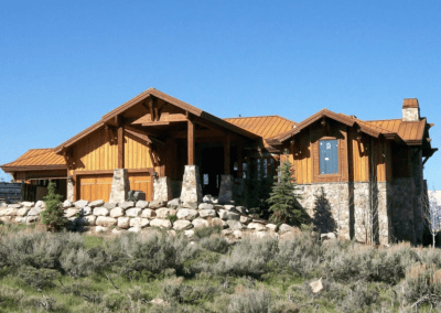 A large home with a stone front.